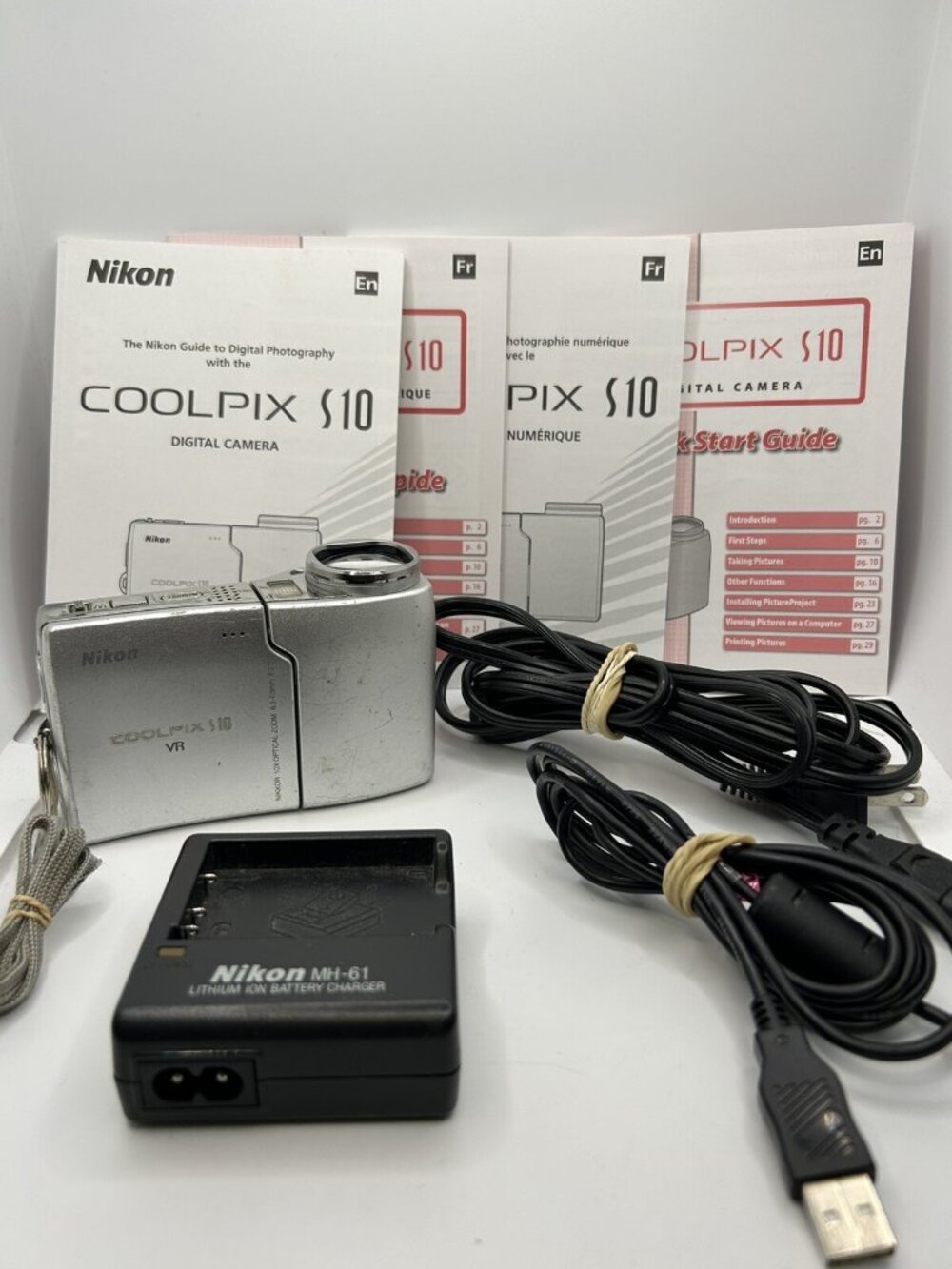 Nikon COOLPIX S10 6.0MP Digital Camera With Cords, Manual, Charger, For Parts